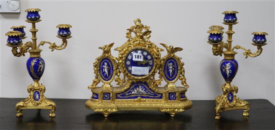 A French ormolu and Sevres style clock garniture